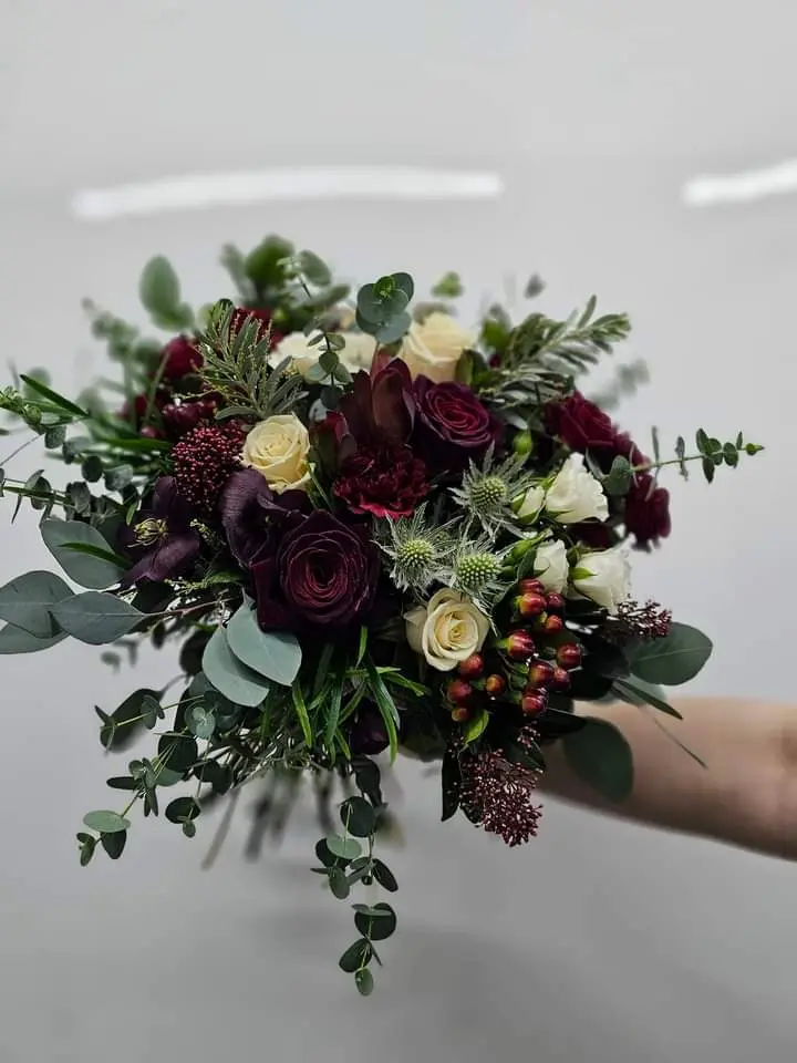Curated seasonal bouquet in artisanal brown paper wrapping