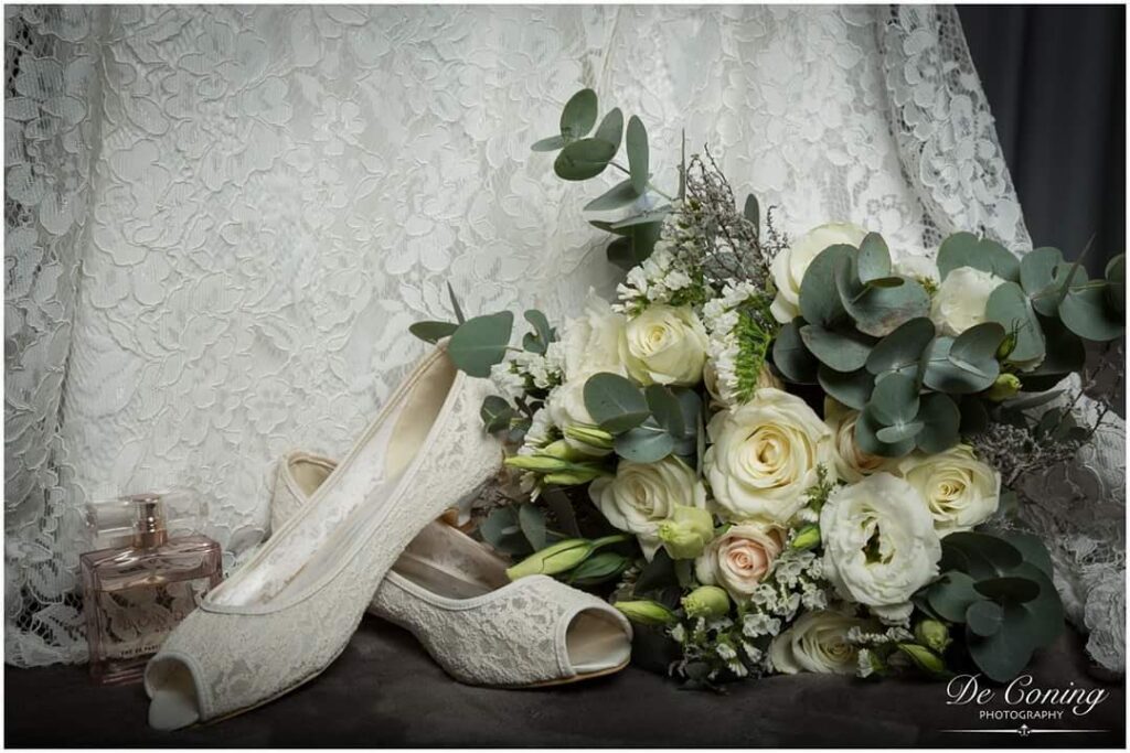 White bridal flowers beside lace details