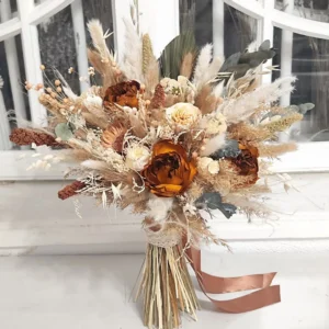 Dried flower bridal bouquet in rust and cream with pampas and ribbon