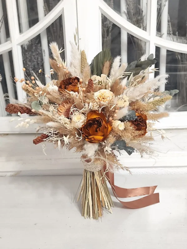 Dried flower bridal bouquet in rust and cream with pampas and ribbon