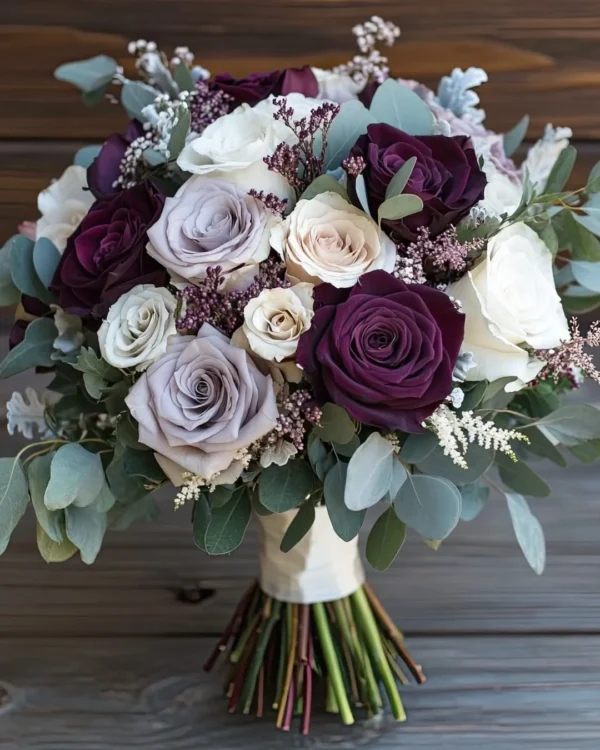 Plum purple and cream rose bridal bouquet with eucalyptus