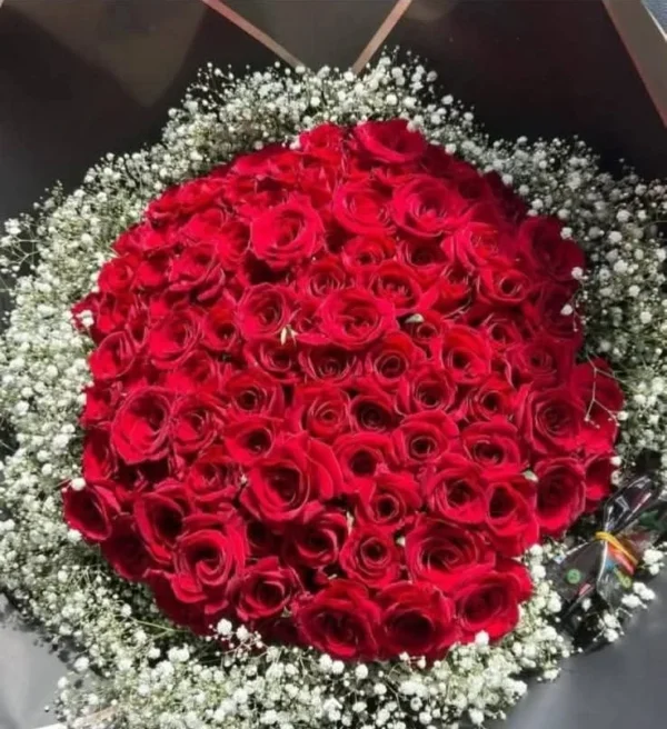Large red rose bouquet with baby breath (cropped to remove app text overlay)