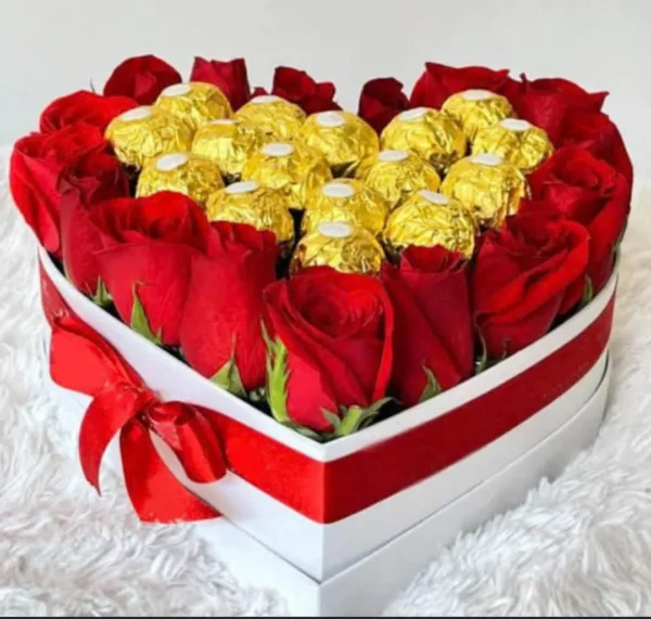 Heart-shaped box of red roses and gold chocolates