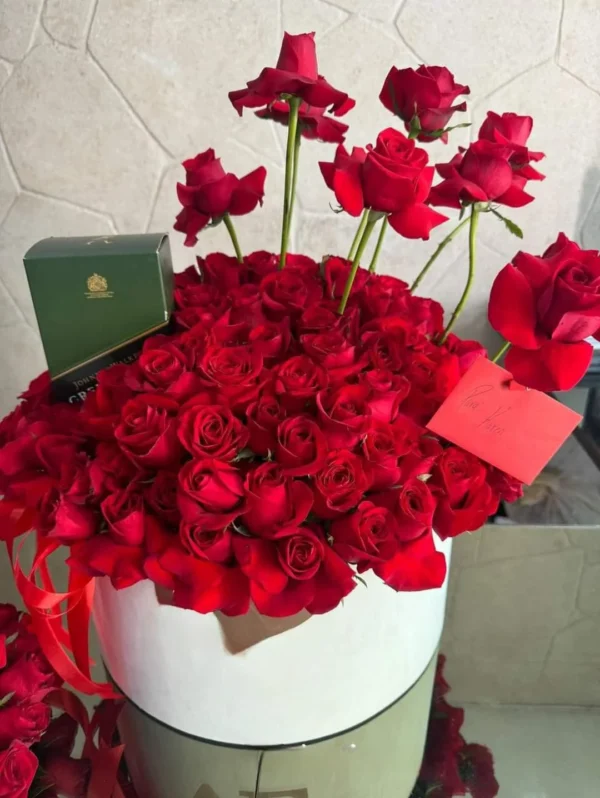 Large hat box of red roses with a gift card